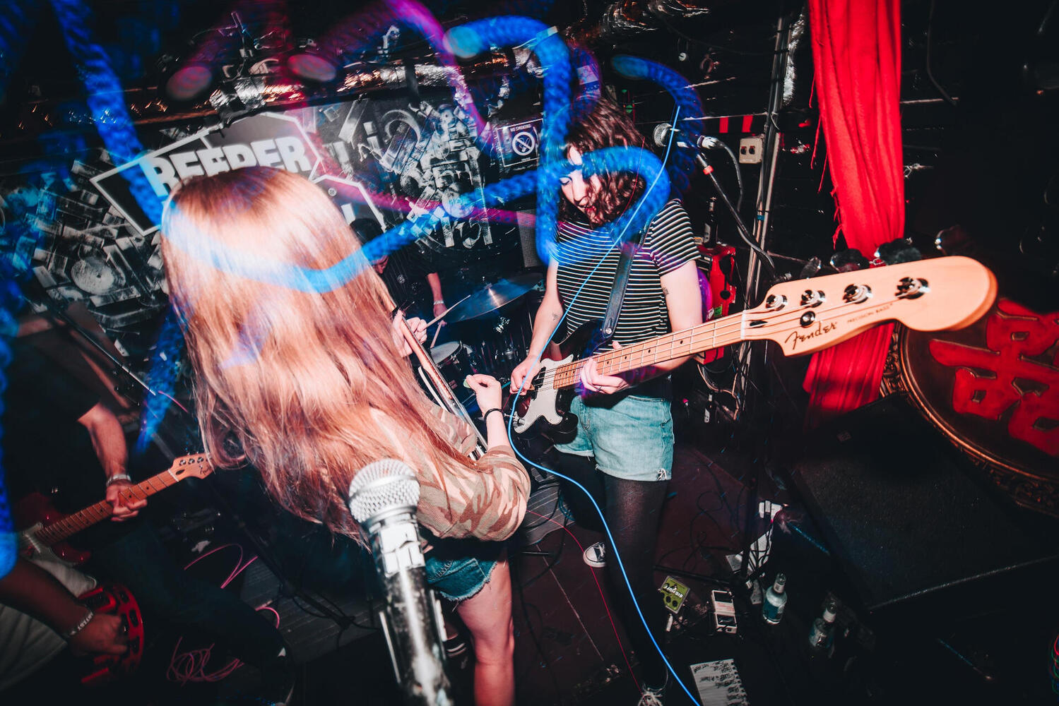 Live photo of J playing bass